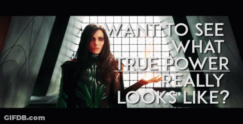 A Woman Stands In Front Of A Window With The Words Want To See What True Power Really Looks Like GIF
