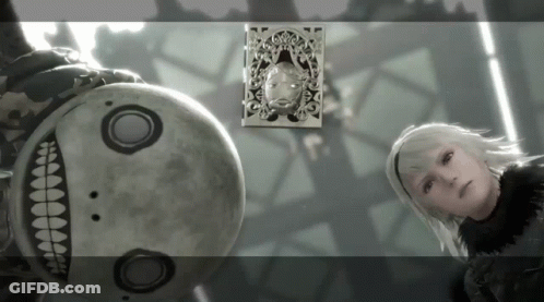 A Woman Stands Next To A Robot With A Picture Of A Woman On The Wall Behind Them GIF