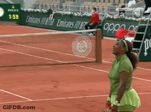A Woman Stands On A Tennis Court In Front Of A Rolex Ad GIF