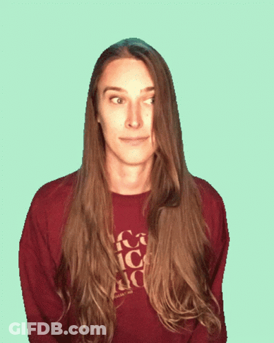 A Woman Sticking Her Tongue Out Wearing A Sweater That Says Coca Cola On It GIF