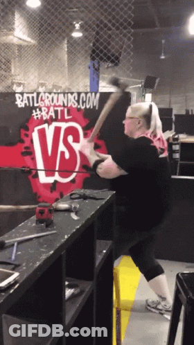 A Woman Swings An Axe In Front Of Battlegrounds.com GIF