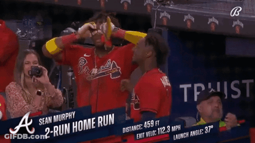 A Woman Takes A Picture Of A Baseball Player Named Sean Murphy In The Dugout GIF