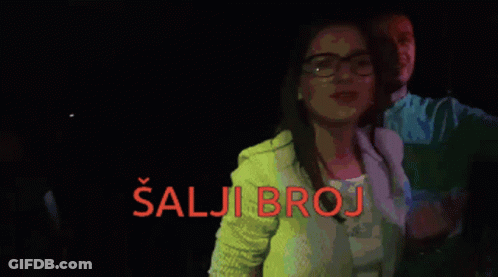 A Woman Taking A Picture Of Herself With The Words Salji Broj Written In Red GIF