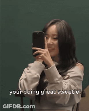 A Woman Taking A Picture Of Herself With The Words Your Doing Great Sweetie Written Below Her GIF
