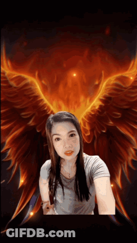 A Woman Taking A Selfie In Front Of A Painting Of A Phoenix GIF