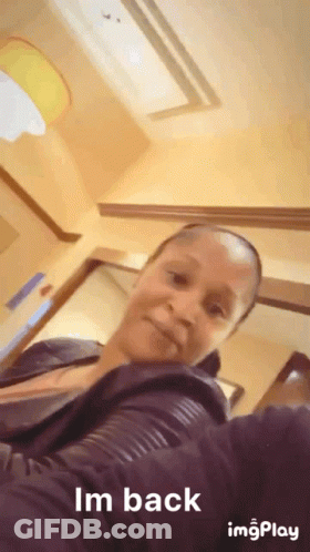 A Woman Taking A Selfie With The Words Im Back On The Bottom GIF
