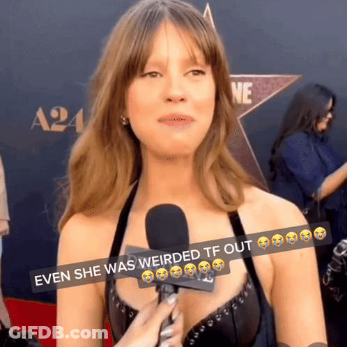 A Woman Talking Into A Microphone With The Words " Even She Was Weirded Tf Out " GIF