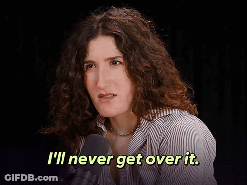 A Woman Talking Into A Microphone With The Words " I 'Ll Never Get Over It " Above Her GIF