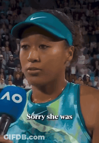 A Woman Talking Into A Microphone With The Words " Sorry She Was " On It GIF