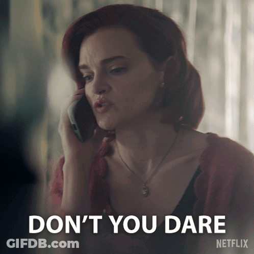 A Woman Talking On A Cell Phone With A Netflix Logo Behind Her GIF