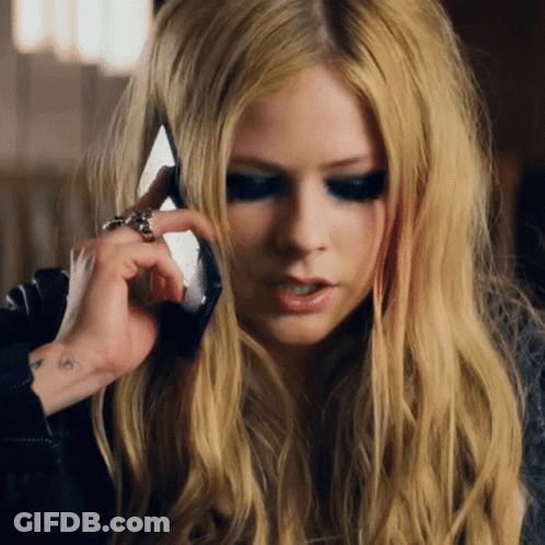 A Woman Talking On A Cell Phone With A Ring On Her Finger GIF