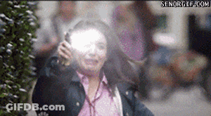 A Woman Talking On A Cell Phone With A Senorgif.com Watermark On The Bottom GIF