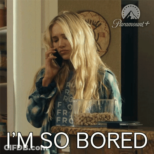A Woman Talking On A Cell Phone With The Words I 'M So Bored Behind Her GIF