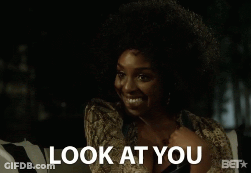 A Woman Talking On A Cell Phone With The Words Look At You Above Her GIF