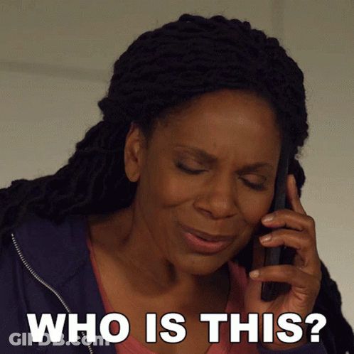 A Woman Talking On A Cell Phone With The Words " Who Is This " Below Her GIF