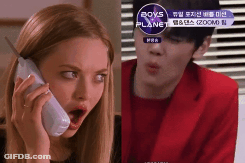 A Woman Talking On A Phone Next To A Man In A Red Jacket With Boys Planet Written On The Bottom GIF