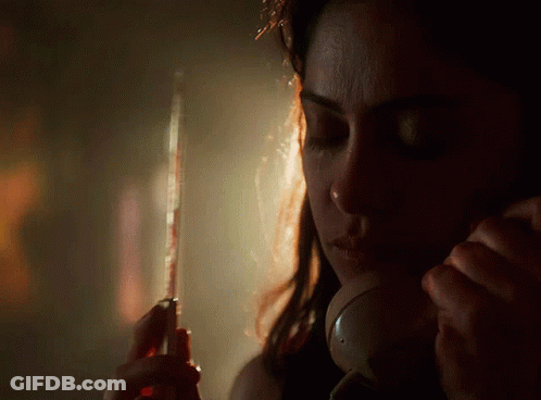 Woman Talking On Phone With Eyes Closed GIF