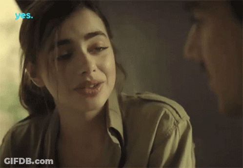 A Woman Talking To A Man With The Word Yes On The Bottom Left GIF
