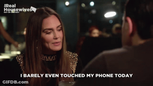 A Woman Talking To A Man With The Words " I Barely Even Touched My Phone Today " GIF