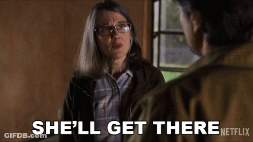 A Woman Talking To A Man With The Words She 'Ll Get There Netflix At The Bottom GIF