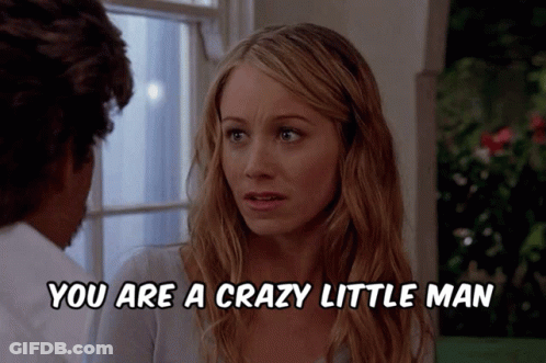 A Woman Talking To A Man With The Words You Are A Crazy Little Man Below Her GIF