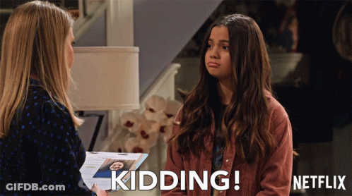 A Woman Talking To Another Woman With The Words Kidding Written On The Bottom GIF