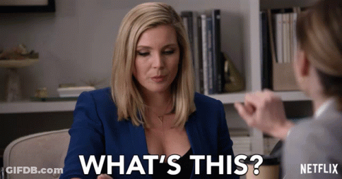 A Woman Talking To Another Woman With The Words " What 'S This " On The Bottom GIF