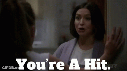 A Woman Talking To Another Woman With The Words " You 'Re A Hit " GIF