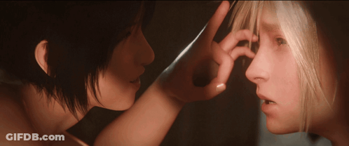 A Woman Touches Another Woman 'S Nose With Her Finger GIF