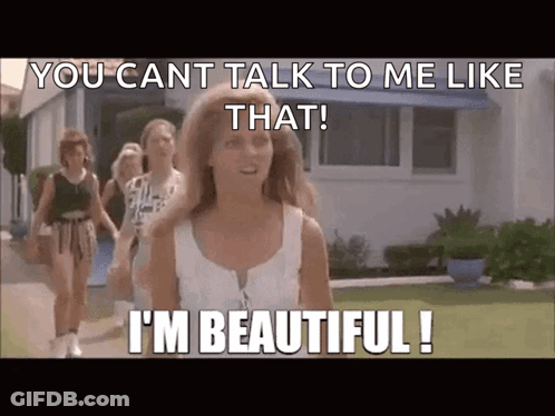 A Woman Walking Down A Street With A Caption That Says " You Cant Talk To Me Like That ! " GIF