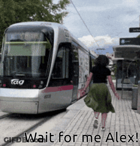 A Woman Walking Towards A Train With The Words Wait For Me Alex GIF