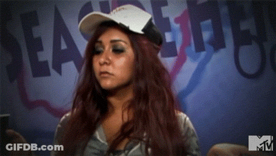A Woman Wearing A Baseball Cap Is Standing In Front Of A Sign That Says Seas The Day GIF