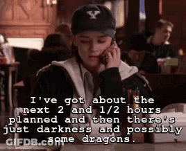 A Woman Wearing A Baseball Cap Is Talking On A Cell Phone In A Restaurant . GIF