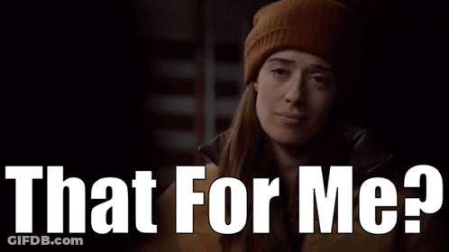 A Woman Wearing A Beanie And A Jacket Is Asking That For Me GIF