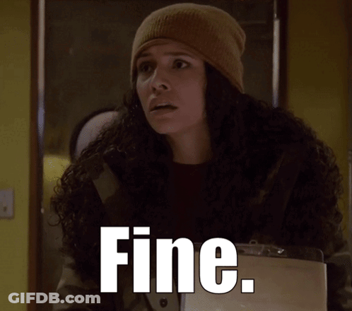 A Woman Wearing A Beanie And A Jacket With The Word Fine Written On It GIF