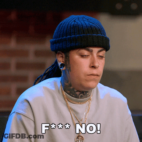 A Woman Wearing A Beanie And A Sweater With The Words F *** No On It GIF