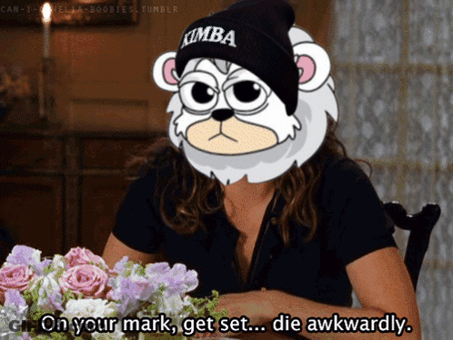 A Woman Wearing A Beanie With Kimba On It GIF