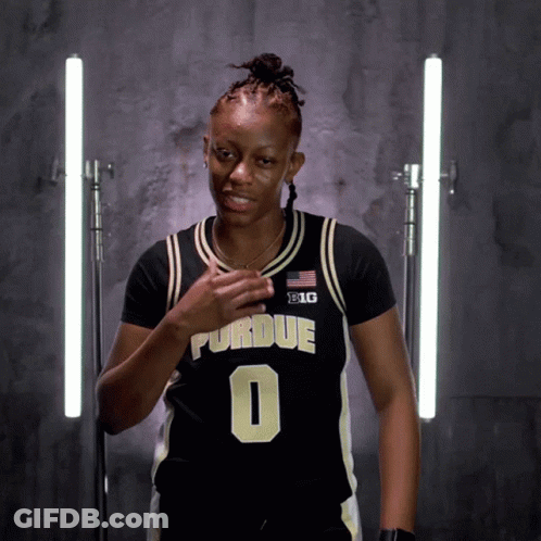 A Woman Wearing A Black And Gold Purdue Jersey Number 0 GIF