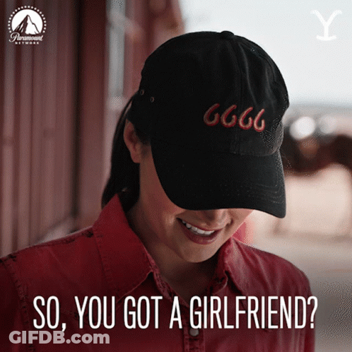 A Woman Wearing A Black Hat With 666 On It GIF