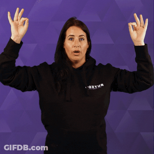 A Woman Wearing A Black Hoodie That Says Foxtur GIF