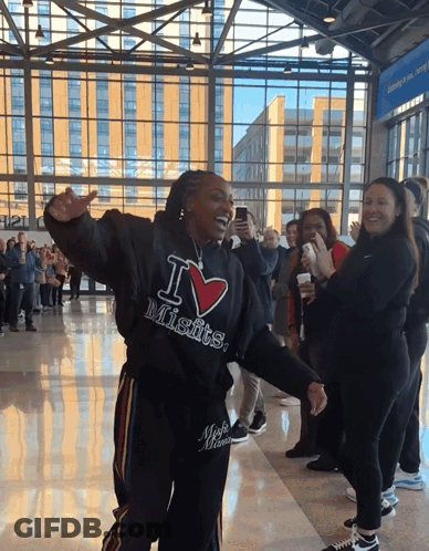 A Woman Wearing A Black Hoodie That Says I Love Misfits GIF