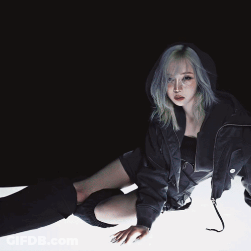 A Woman Wearing A Black Jacket And Black Knee High Socks GIF