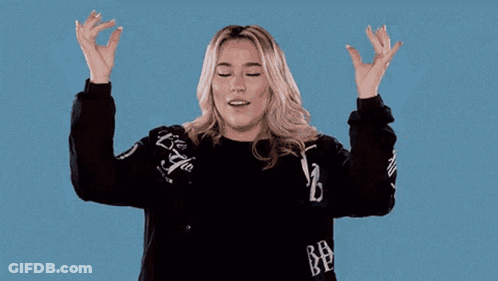 A Woman Wearing A Black Jacket With The Letter B On The Sleeves GIF