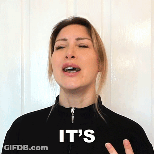 A Woman Wearing A Black Jacket With The Word It 'S On It GIF