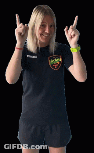 A Woman Wearing A Black Princess Hockey Shirt GIF