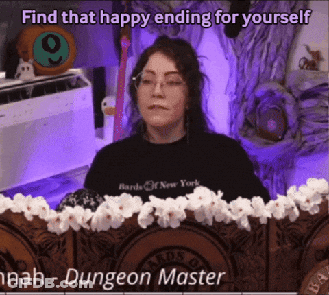 A Woman Wearing A Black Shirt That Says Bards Of New York Sits At A Table GIF