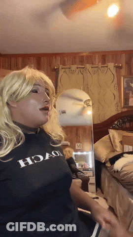 A Woman Wearing A Black Shirt That Says Hoao On It GIF