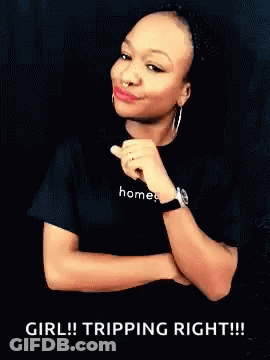 A Woman Wearing A Black Shirt That Says Homes GIF