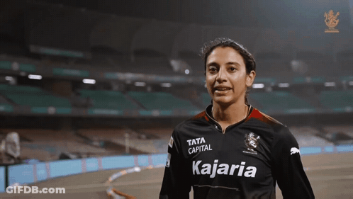 A Woman Wearing A Black Shirt That Says Kajaria On It GIF
