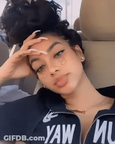 A Woman Wearing A Black Shirt That Says Yaw Mu On It GIF